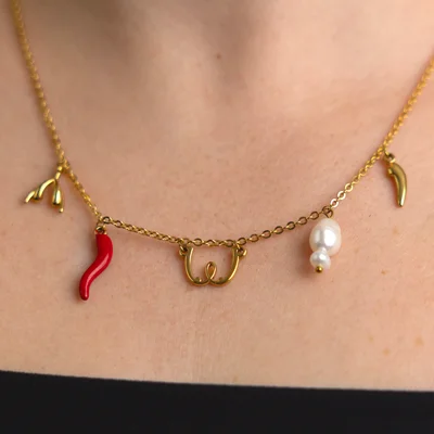 womanizer gold charm necklace